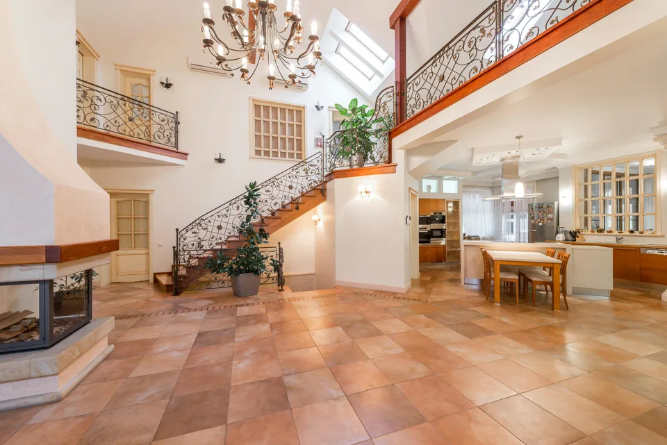 Large tile flooring in a two-story entryway